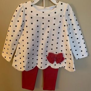 Polka dot top and red leggings